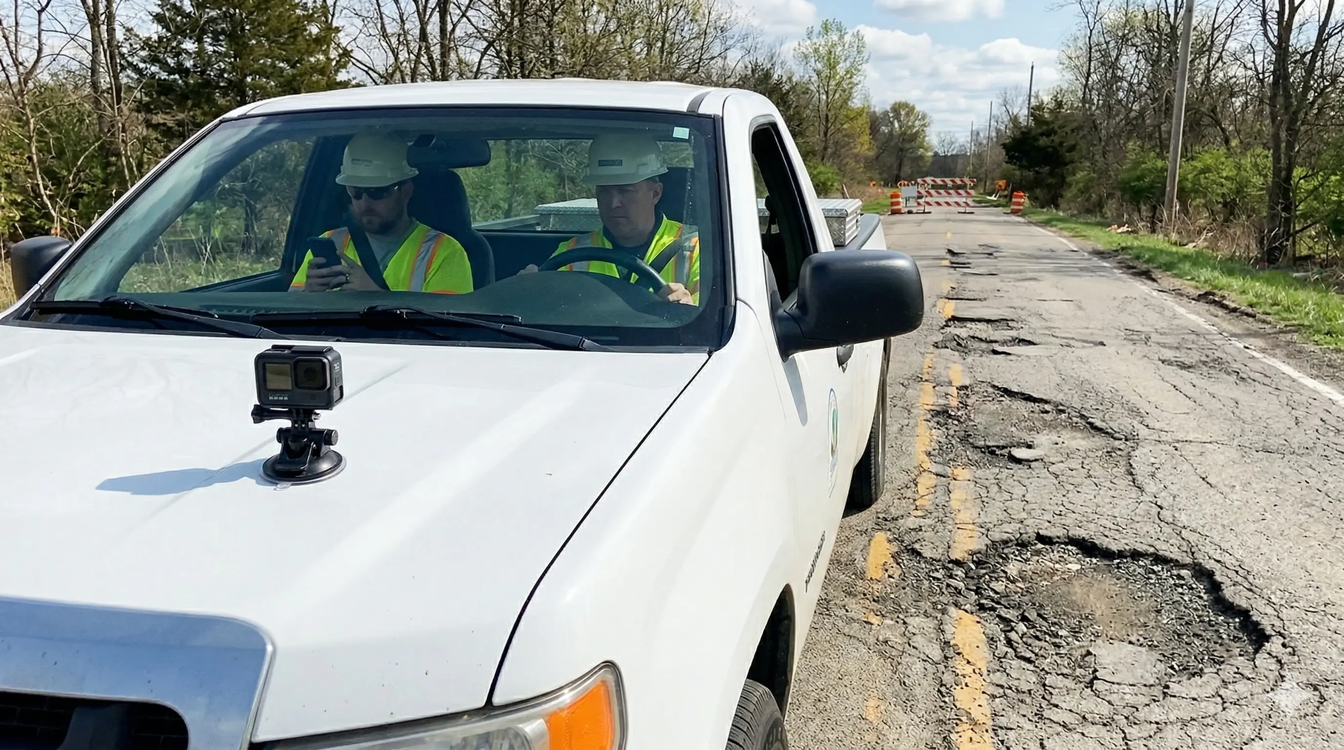 Flowity App background image showing road surveying with a GoPro camera
